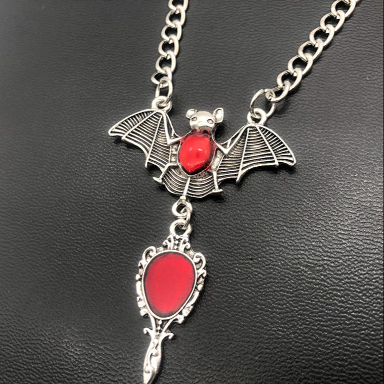 Add a darkly elegant edge to your look with this striking Red Bat Necklace—perfect for gothic, punk, grunge, witchy, emo, and alternative aesthetics. This necklace isn’t just an accessory—it’s a bold statement piece that complements your personal style with confidence and darkness. Whether layered with chokers or worn solo, it adds instant mystique to any outfit.
Unique Features and Characteristics of the Red Bat Necklace
Striking Red Bat Design: Detailed crimson enamel wings contrasted with a sleek silver