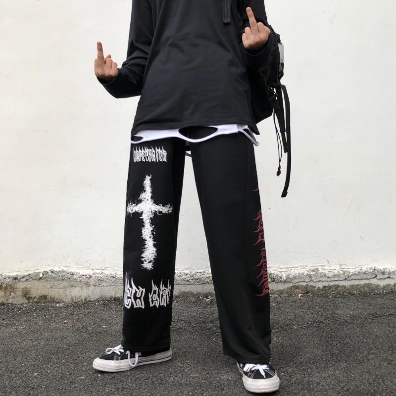 Man wearing Gothic Jeans with Cross Design