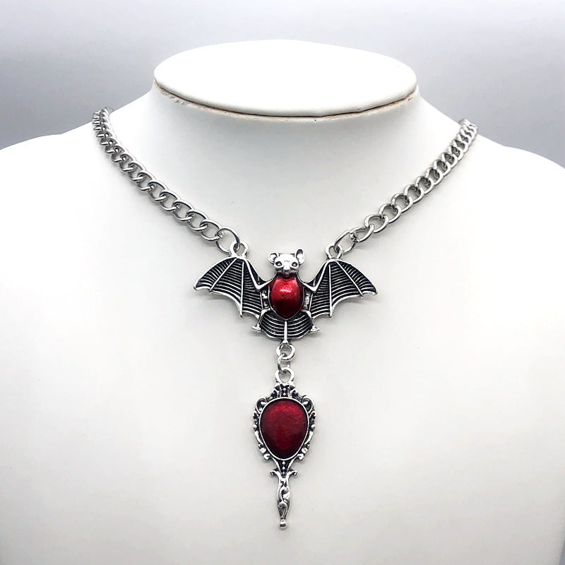 Add a darkly elegant edge to your look with this striking Red Bat Necklace—perfect for gothic, punk, grunge, witchy, emo, and alternative aesthetics. This necklace isn’t just an accessory—it’s a bold statement piece that complements your personal style with confidence and darkness. Whether layered with chokers or worn solo, it adds instant mystique to any outfit.

Unique Features and Characteristics of the Red Bat Necklace
Striking Red Bat Design: Detailed crimson enamel wings contrasted with a sleek silver